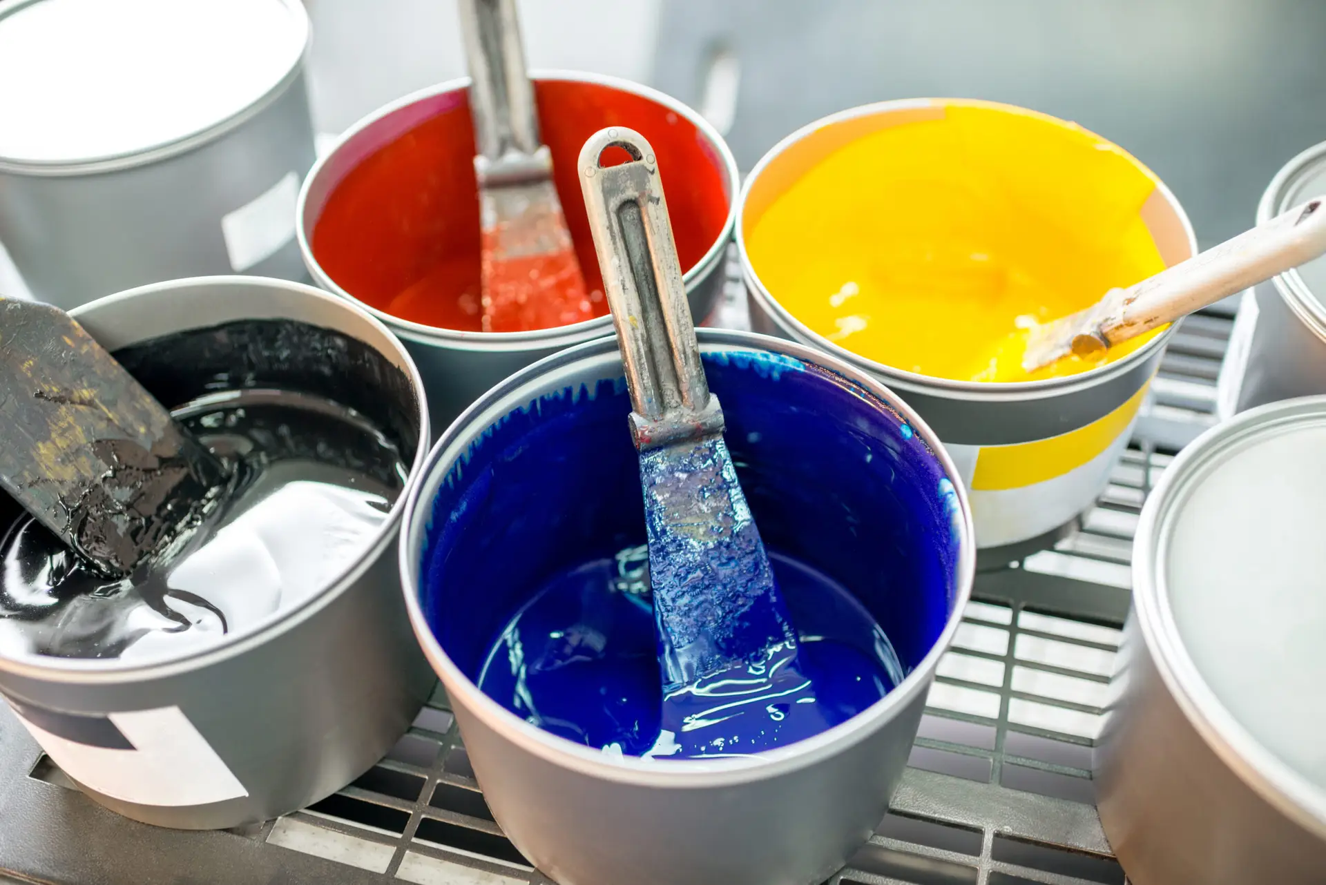 Buckets of paint with pallet knife