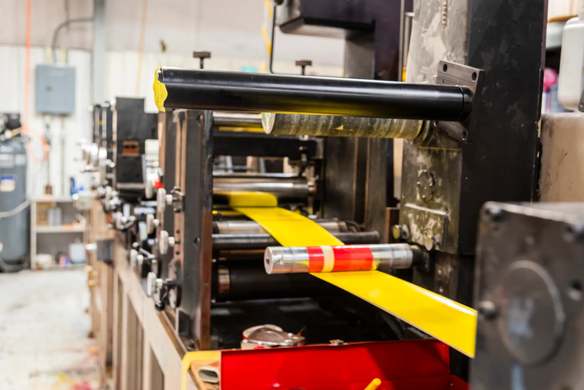 Yellow labels running through a Flexo press